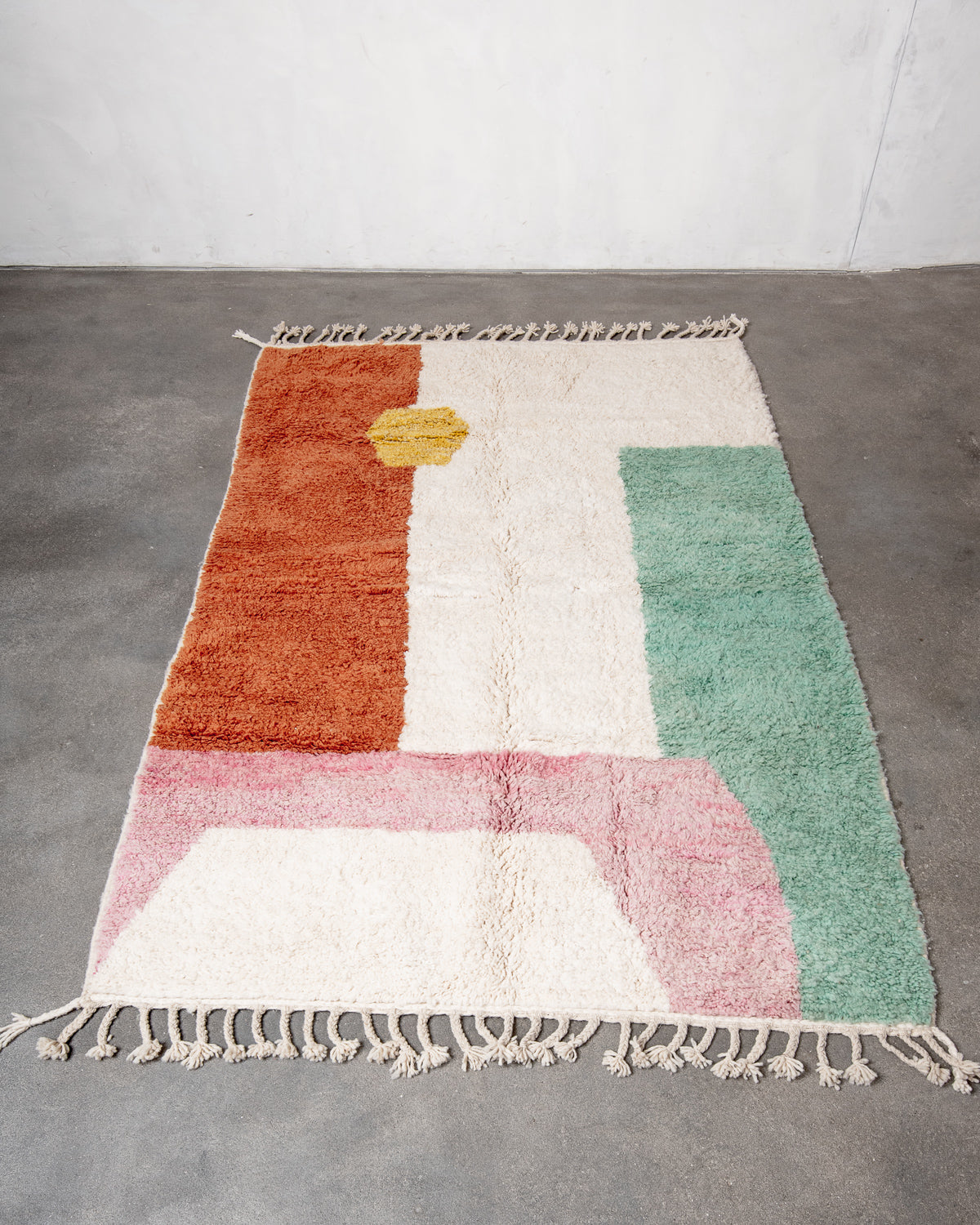 Modern, designer, handcrafted Berber rug from Morocco. Beniourain carpet with beautiful colours and patterns and fluffy wool texture.